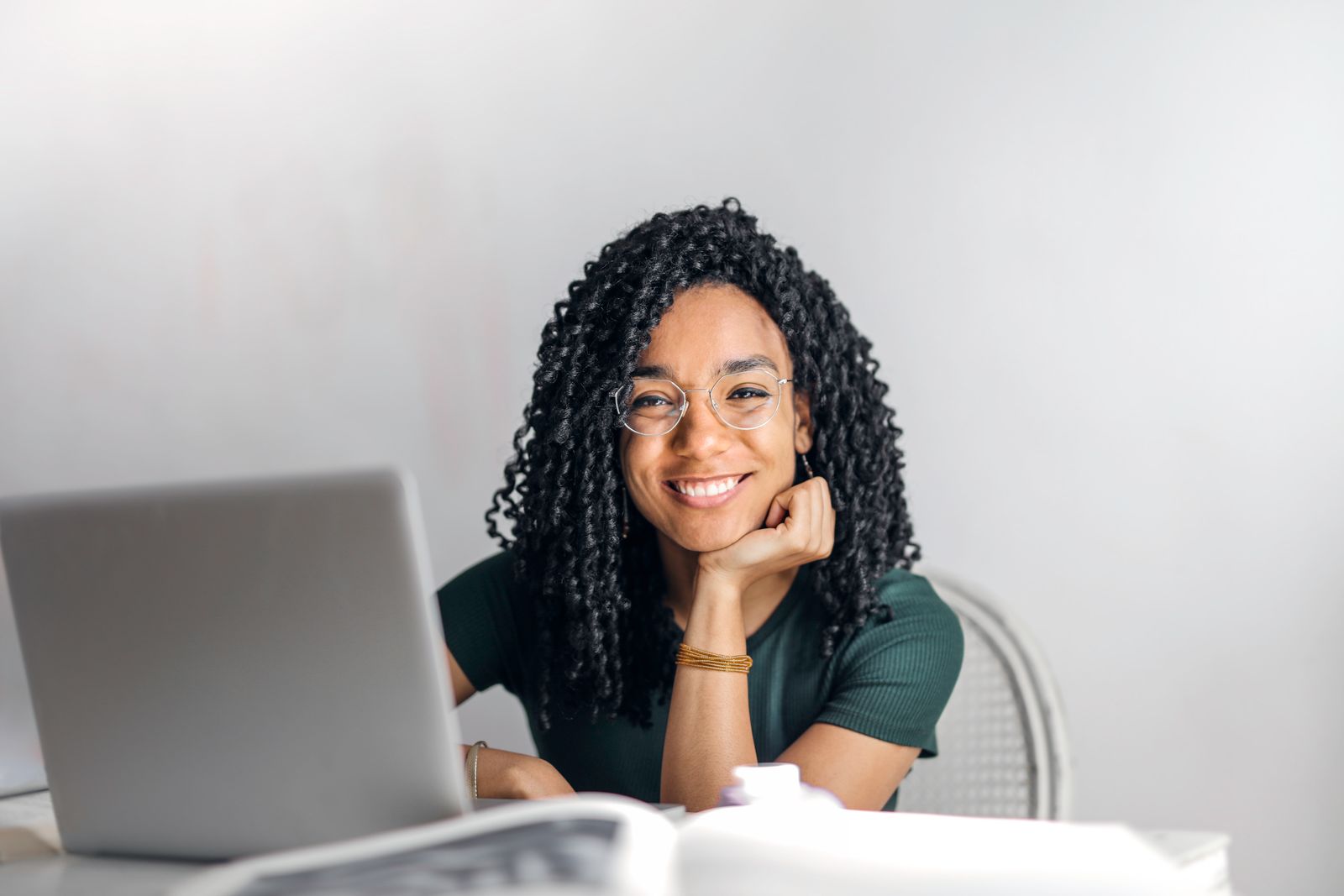 Confident business owner working at a laptop